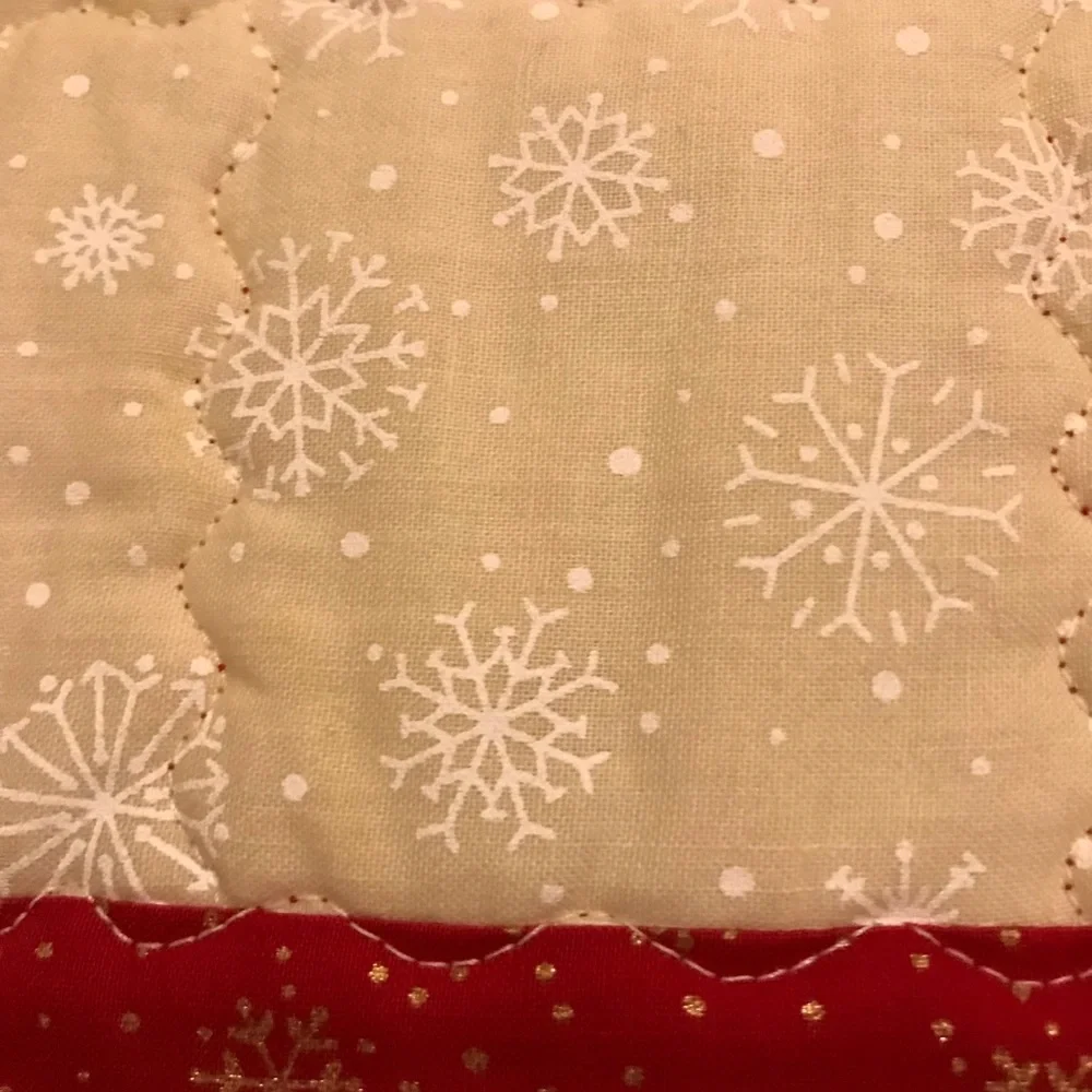 Handcrafted a quilted reversible table runner. Lots of stitching detail